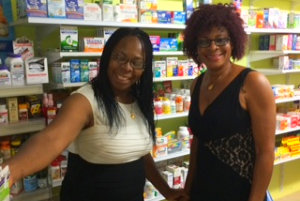 two women smiling in the pharmacy